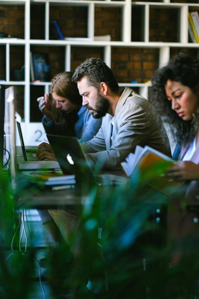 Staff pictured at desks